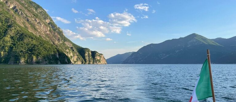 Lake Iseo as seen from the water, nestled among the mountains